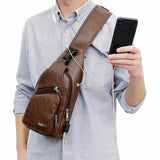 Load image into Gallery viewer, Display of Leather Crossbody Sling Chest Bag w/ USB Charge Port